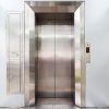 Modern elevator with closed metal doors.