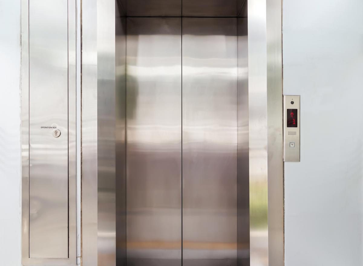 Modern elevator with closed metal doors.